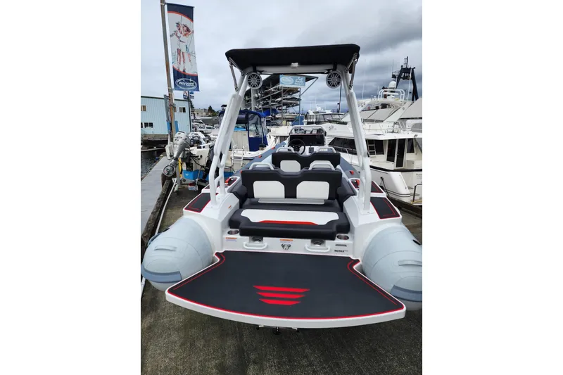 Slide: The Image of Highfield Velox 560 boat, 2026 model, docked at a marina with sleek design. - 3