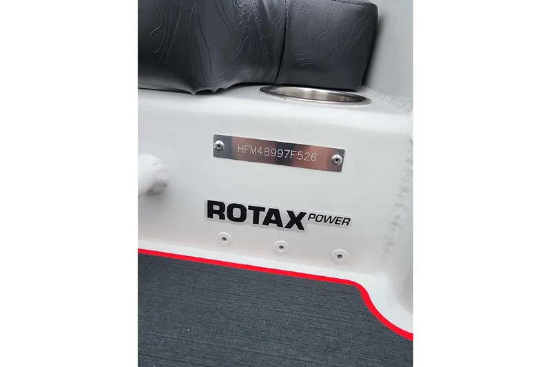 Slide: The Image of 2026 Highfield Velox 560 boat interior with Rotax Power branding and serial number plate. - 4