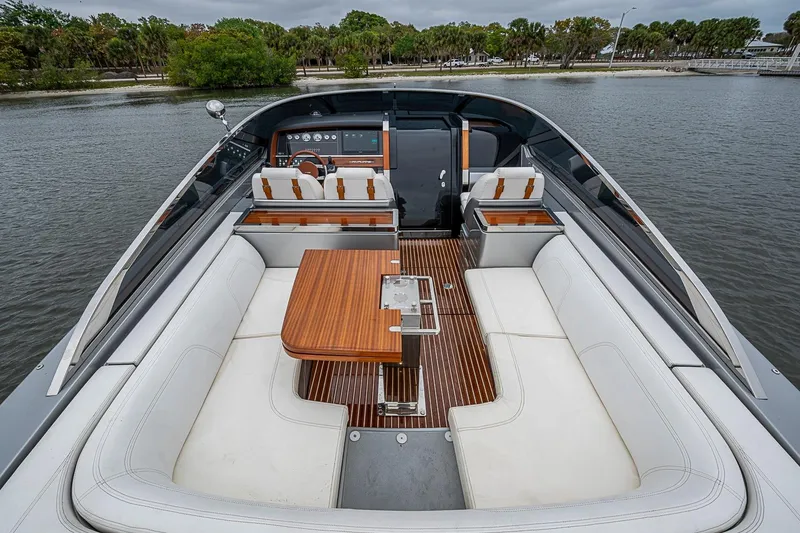 Slide: The Image of Luxurious 2020 Riva 38' Rivamare yacht interior with elegant seating and wooden table. - 13
