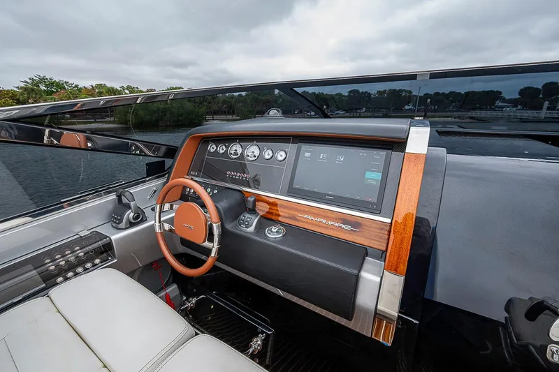 Slide: The Image of Dashboard of 2020 Riva 38' Rivamare yacht with modern controls and steering wheel. - 14