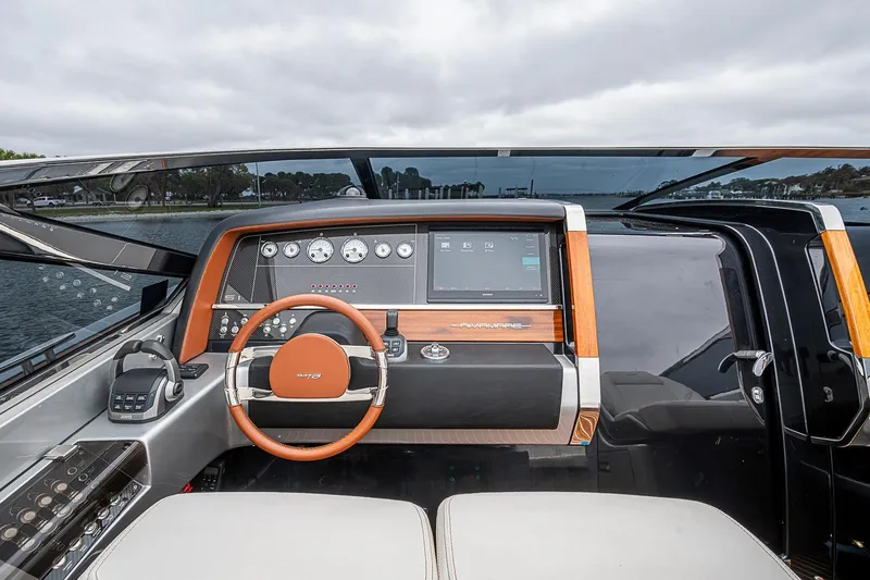 Slide: The Image of Cockpit of 2020 Riva 38' Rivamare yacht with modern dashboard and steering wheel. - 15