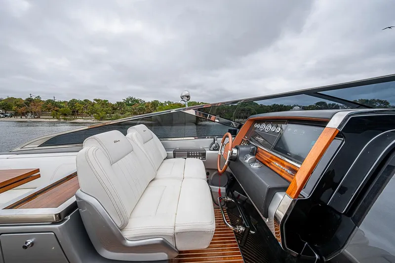 Slide: The Image of Luxurious 2020 Riva 38' Rivamare yacht interior with sleek dashboard and plush seating. - 16
