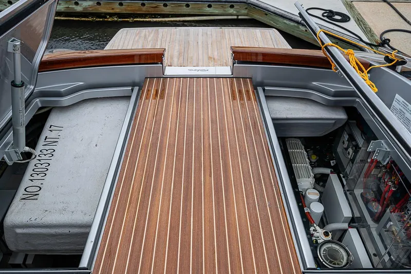 Slide: The Image of Engine compartment of 2020 Riva 38' Rivamare with wooden deck and mechanical components. - 28