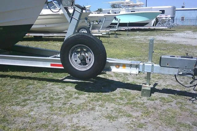 Slide: The Image of Trailer for 2004 Grady White 27 Islander boat on grassy lot. - 10