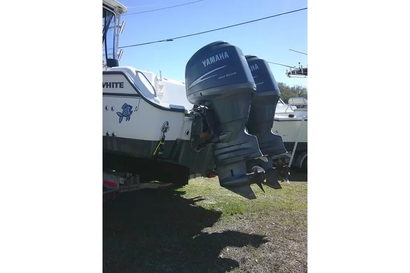 Slide: The Image of 2004 Grady White 27 Islander boat with twin Yamaha outboard motors. - 13