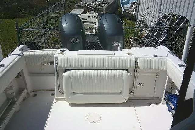 Slide: The Image of 2004 Grady White 27 Islander boat deck with twin Yamaha 150 engines. - 17