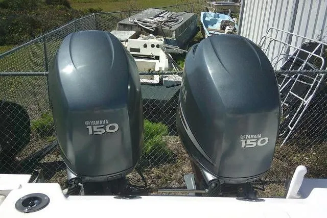 Slide: The Image of Twin Yamaha 150 outboard motors on a 2004 Grady White 27 Islander boat. - 20