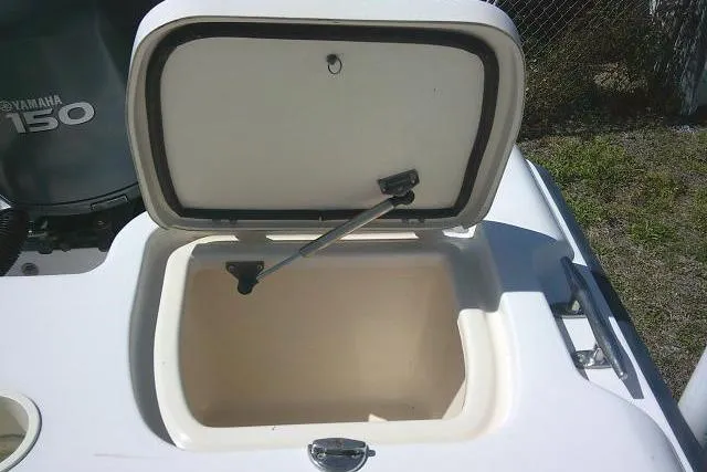 Slide: The Image of Open storage compartment on a 2004 Grady White 27 Islander boat. - 23