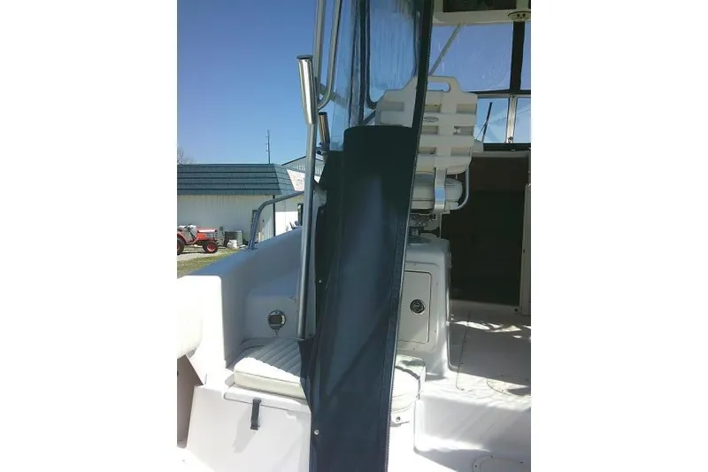 Slide: The Image of 2004 Grady White 27 Islander boat interior with seating and helm station. - 26