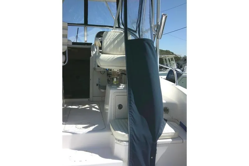 Slide: The Image of 2004 Grady White 27 Islander boat interior with seating and canopy. - 27