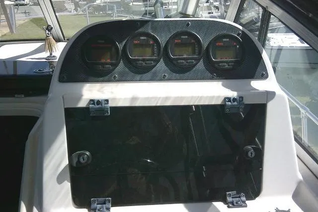 Slide: The Image of Dashboard of a 2004 Grady White 27 Islander boat with four gauges. - 37