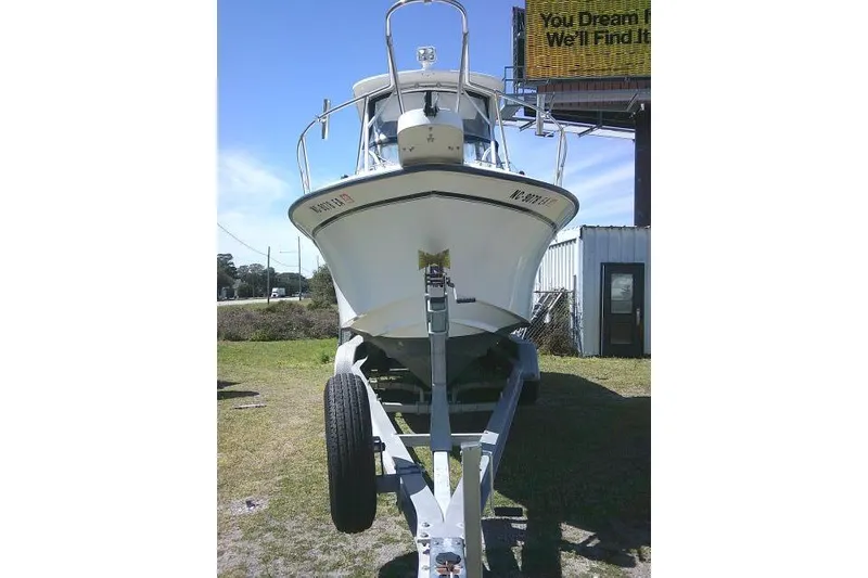 Slide: The Image of 2004 Grady White 27 Islander boat on trailer, parked outdoors. - 4