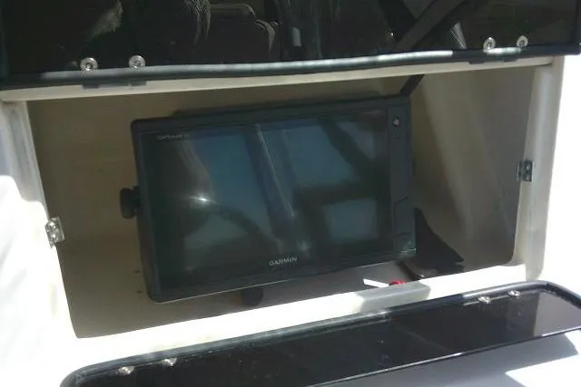 Slide: The Image of Garmin GPS device installed in a 2004 Grady White 27 Islander boat compartment. - 40