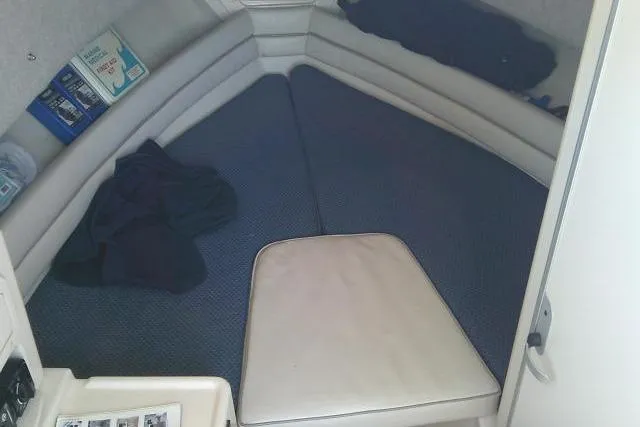 Slide: The Image of Interior cabin of 2004 Grady White 27 Islander boat, featuring cushioned seating. - 43