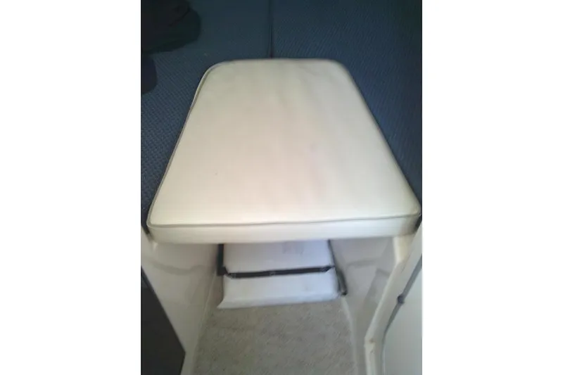 Slide: The Image of 2004 Grady White 27 Islander cabin interior with cushioned seating. - 44