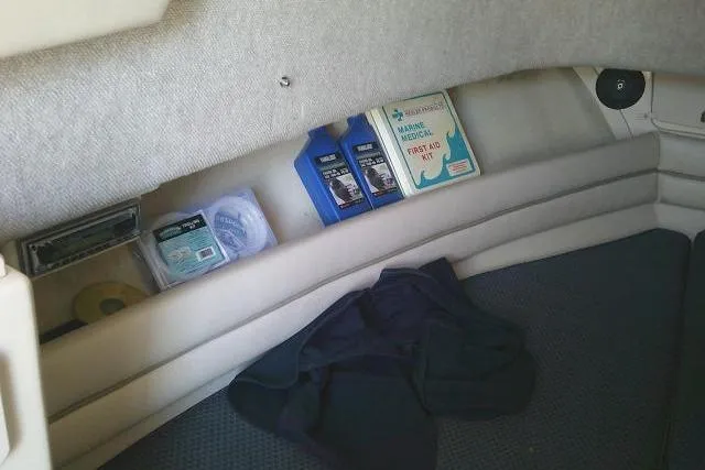 Slide: The Image of Interior of 2004 Grady White 27 Islander with marine supplies and first aid kit. - 46