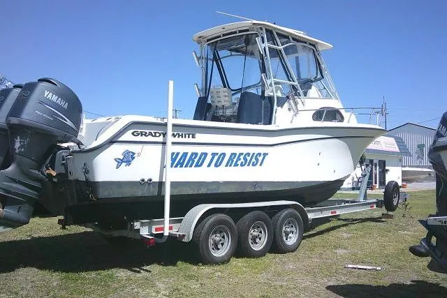 Slide: The Image of 2004 Grady White 27 Islander boat on trailer with Yamaha engines, side view. - 5