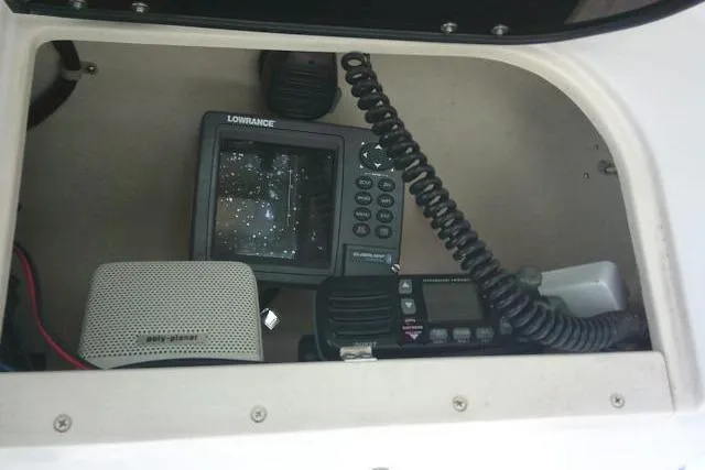 Slide: The Image of Electronics panel on 2004 Grady White 27 Islander boat with Lowrance equipment. - 55