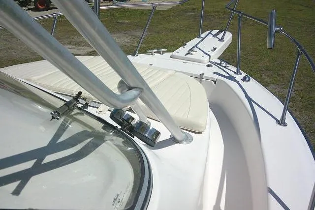 Slide: The Image of 2004 Grady White 27 Islander boat deck with seating and railing. - 58