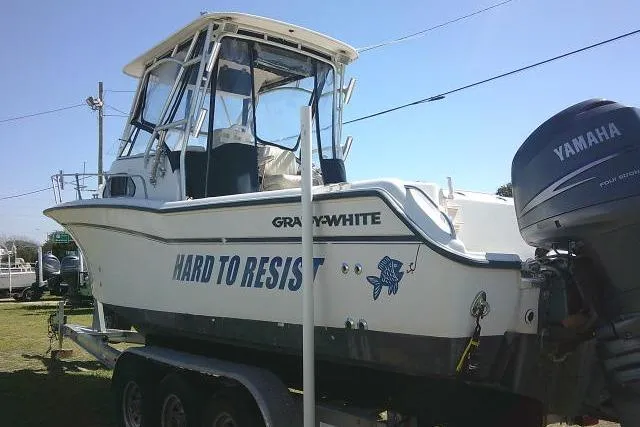 Slide: The Image of 2004 Grady White 27 Islander boat on trailer with Yamaha outboard motor. - 8