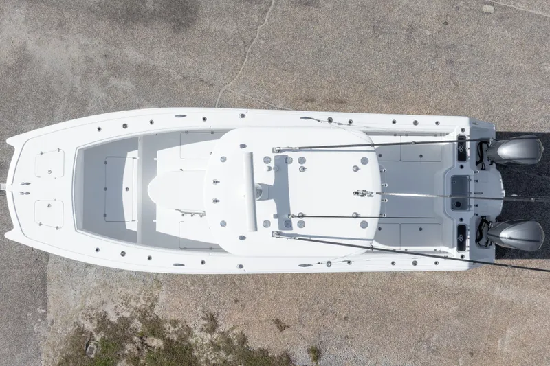 Slide: The Image of Aerial view of a 2014 Freeman 33 boat with dual outboard motors. - 10