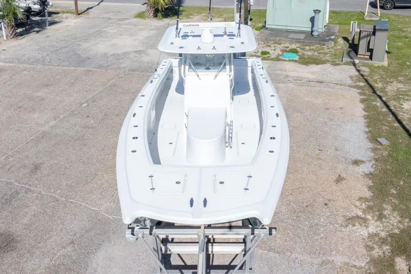 Slide: The Image of Aerial view of a 2014 Freeman 33 boat on a trailer in a parking area. - 16