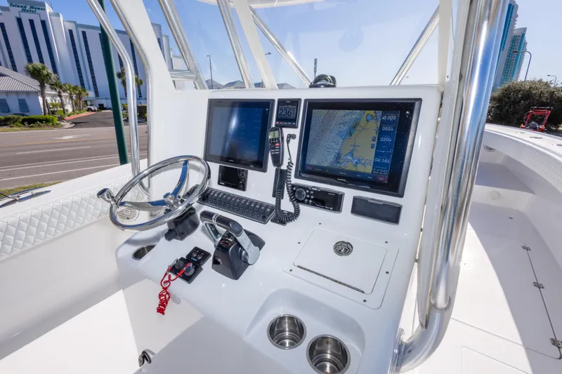 Slide: The Image of Freeman 33 boat dashboard with navigation screens and steering wheel, 2014 model. - 22