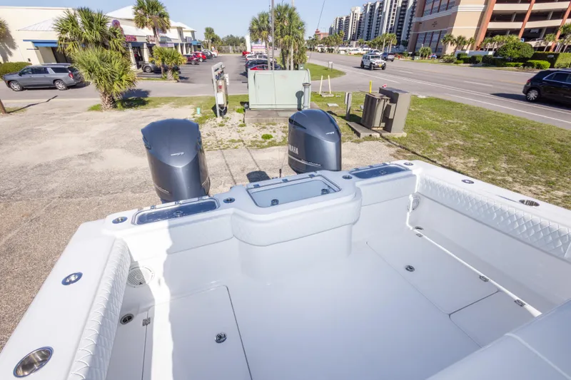 Slide: The Image of Freeman 33 boat, 2014 model, with dual Yamaha engines, parked near a street. - 30