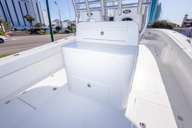 Slide: The Image of 2014 Freeman 33 boat interior with storage compartments and sleek white design. - 33