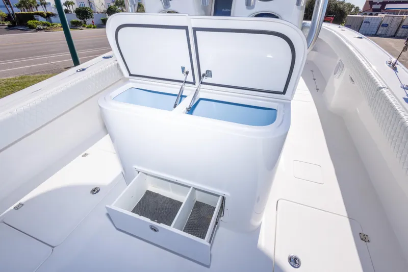 Slide: The Image of 2014 Freeman 33 boat interior with open storage compartments and sleek design. - 34