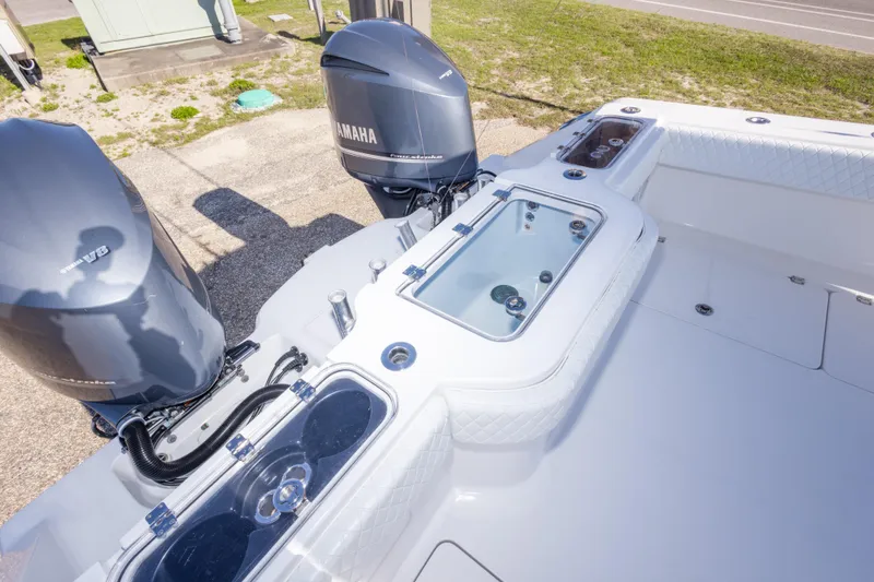 Slide: The Image of Freeman 33 boat with Yamaha outboard engines, featuring a spacious deck and storage compartments. - 35