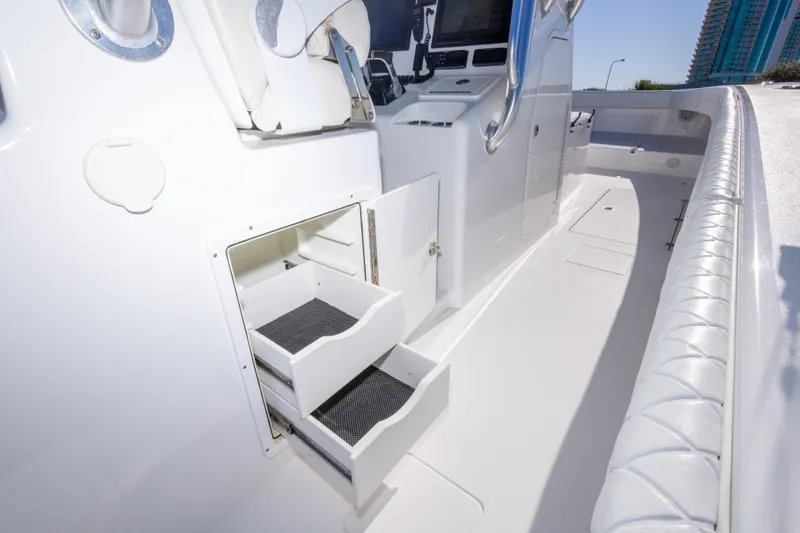 Slide: The Image of Interior of a 2014 Freeman 33 boat with open storage compartments. - 38