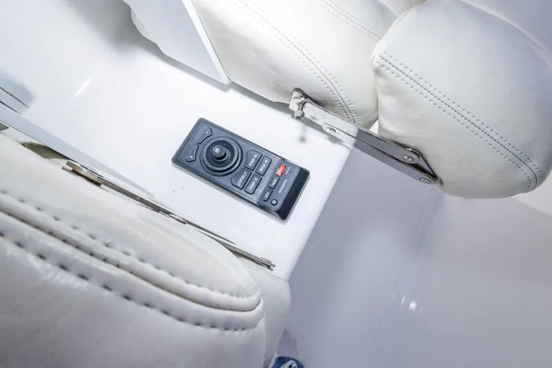 Slide: The Image of Boat interior with control panel and white leather seating, Freeman 33, 2014 model. - 39