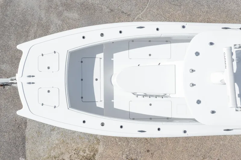 Slide: The Image of Aerial view of a 2014 Freeman 33 boat, showcasing its sleek white deck design. - 4