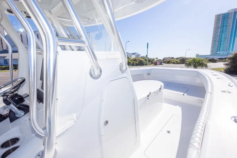 Slide: The Image of 2014 Freeman 33 boat interior with sleek design and modern amenities, docked near coastal buildings. - 44