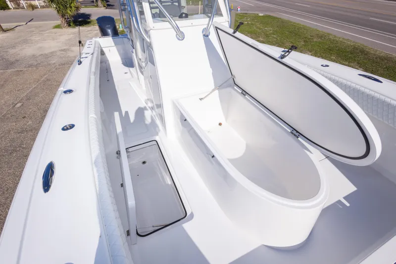 Slide: The Image of Open storage compartment on a 2014 Freeman 33 boat deck, showcasing spacious interior. - 49