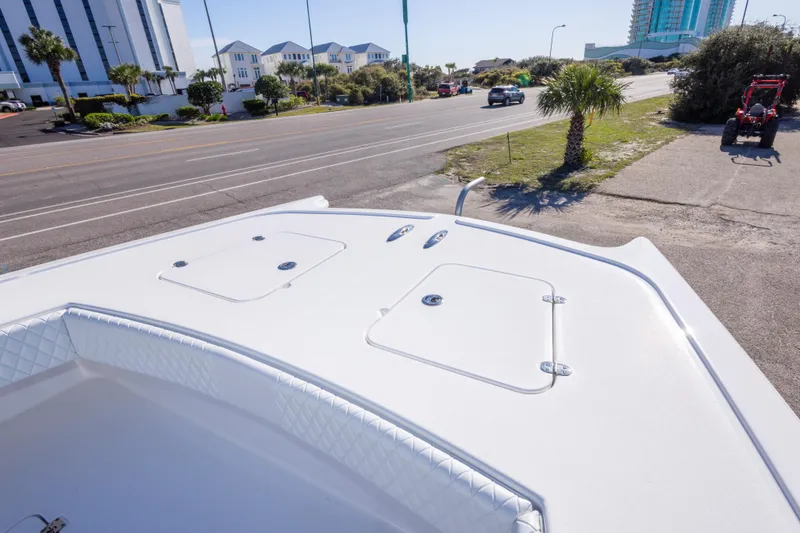 Slide: The Image of Bow view of 2014 Freeman 33 boat near a coastal road with palm trees. - 50