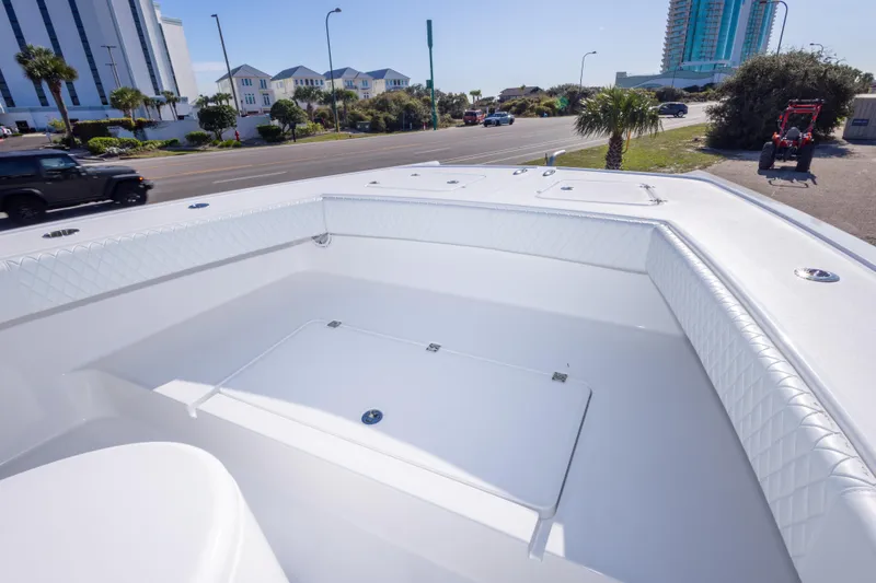 Slide: The Image of Freeman 33 boat interior, 2014 model, with white seating and urban background. - 51