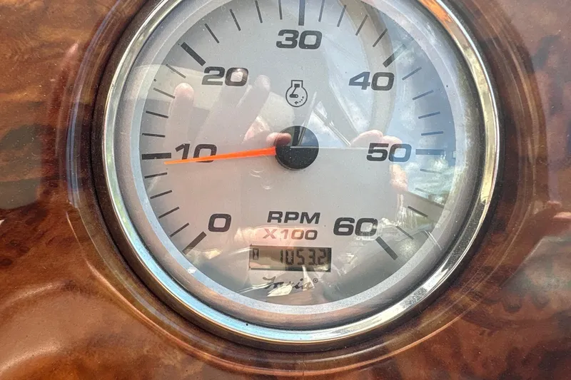 Slide: The Image of Close-up of 2004 Rinker Fiesta Vee 312 RPM gauge showing 1053.2 hours. - 13