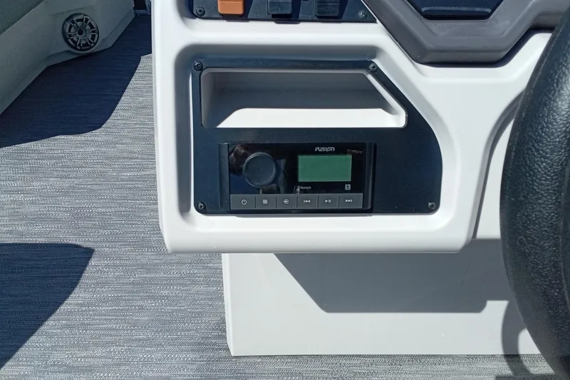 Slide: The Image of Control panel of 2023 Godfrey Sweetwater 2086 CX boat with Fusion audio system. - 10