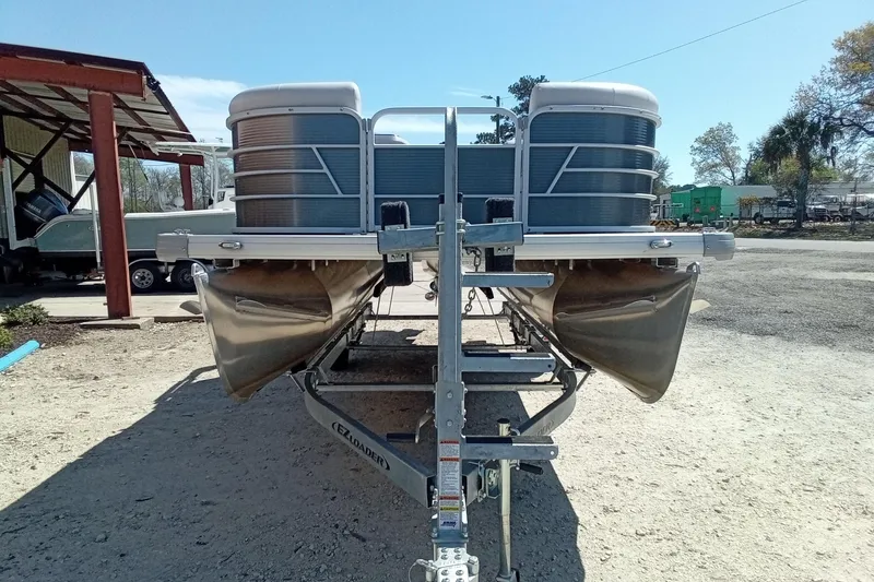 Slide: The Image of 2023 Godfrey Sweetwater 2086 CX pontoon boat on trailer, parked outdoors. - 5