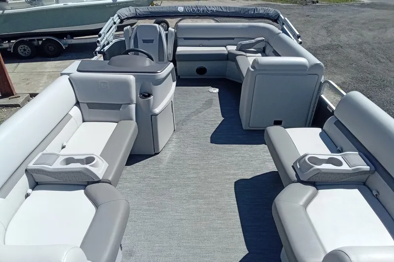 Slide: The Image of 2023 Godfrey Sweetwater 2086 CX pontoon boat interior with spacious seating and cup holders. - 6