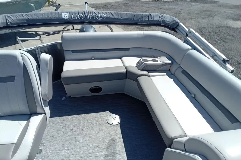 Slide: The Image of 2023 Godfrey Sweetwater 2086 CX pontoon boat interior with gray seating and cup holders. - 7