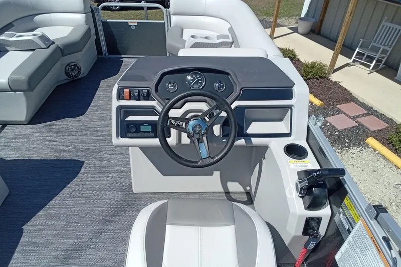 Slide: The Image of 2023 Godfrey Sweetwater 2086 CX boat interior with steering console and seating. - 9
