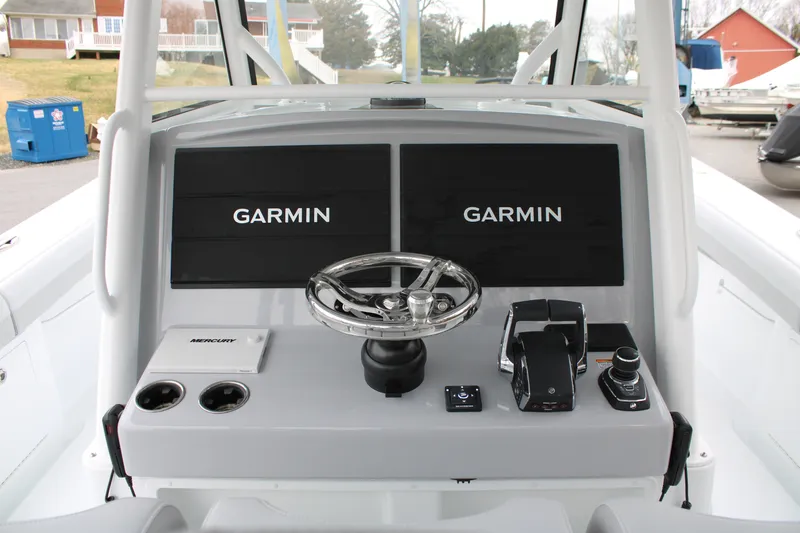 Slide: The Image of 2026 Yellowfin 39 Offshore boat dashboard with Garmin displays and Mercury controls. - 14