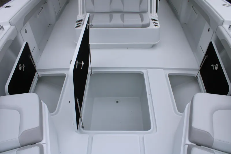 Slide: The Image of 2026 Yellowfin 39 Offshore boat interior with open storage compartments and seating. - 21