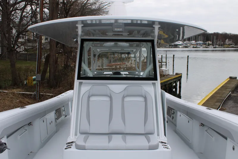 Slide: The Image of 2026 Yellowfin 39 Offshore boat with sleek seating and modern design by the water. - 22