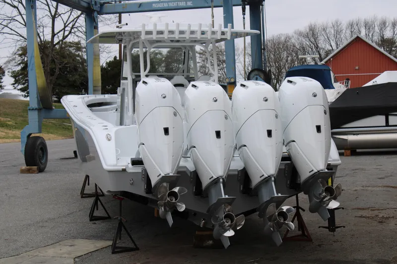 Slide: The Image of 2026 Yellowfin 39 Offshore boat with four powerful outboard engines in a shipyard. - 6