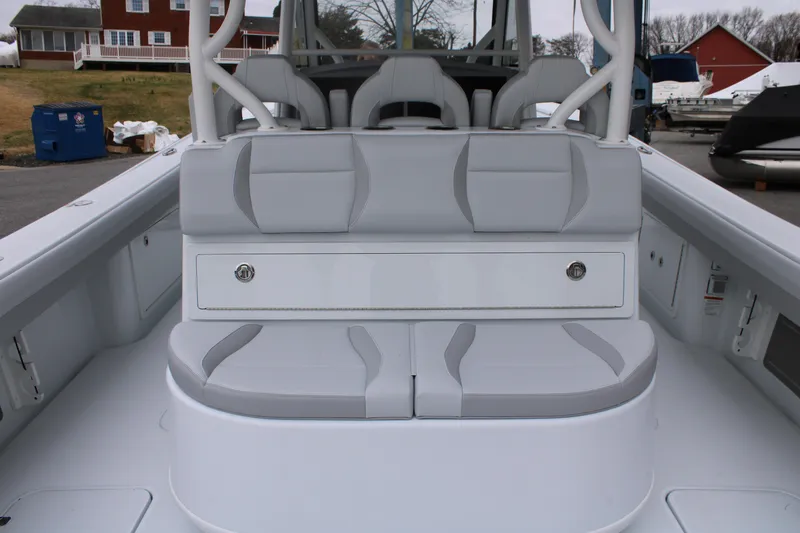 Slide: The Image of 2026 Yellowfin 39 Offshore boat interior with gray seating and storage compartment. - 8