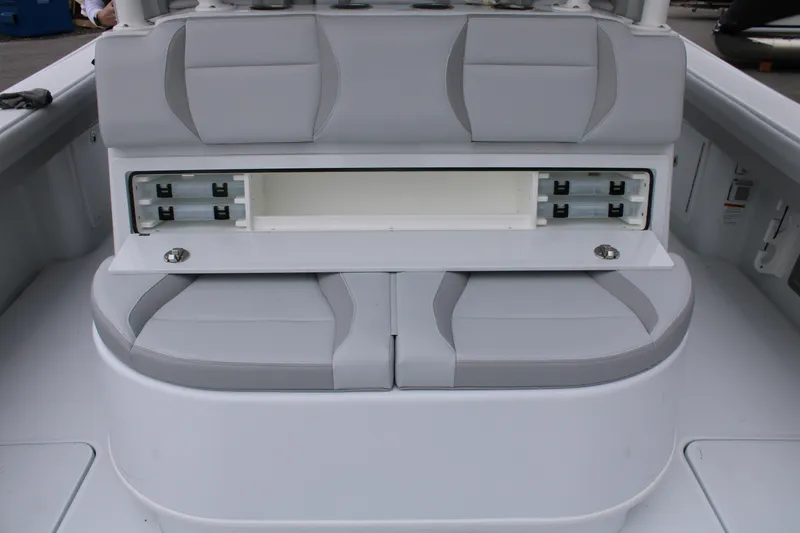 Slide: The Image of 2026 Yellowfin 39 Offshore boat seating with storage compartment open. - 9